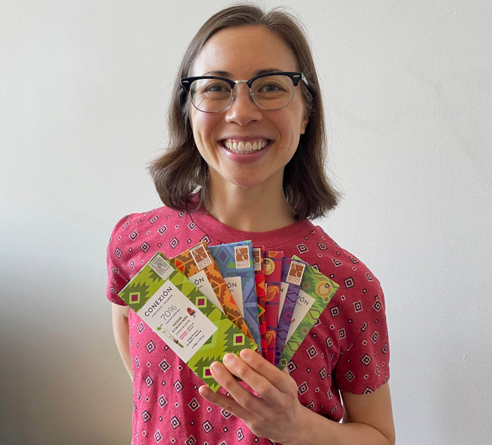 Sustainable chocolate expert Madeline Weeks holding Conexion Chocolate bars